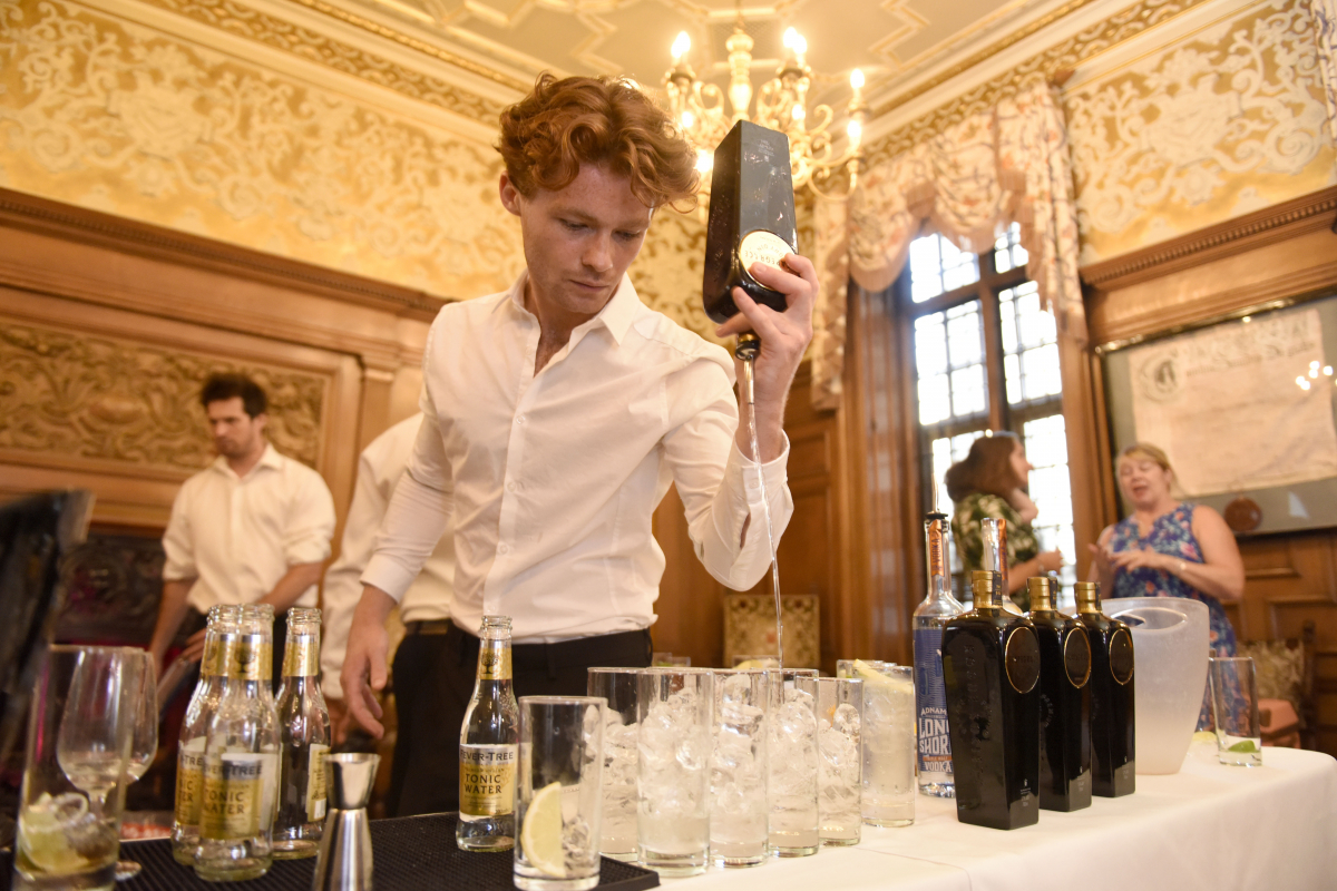 Bartender mixing gin and tonic